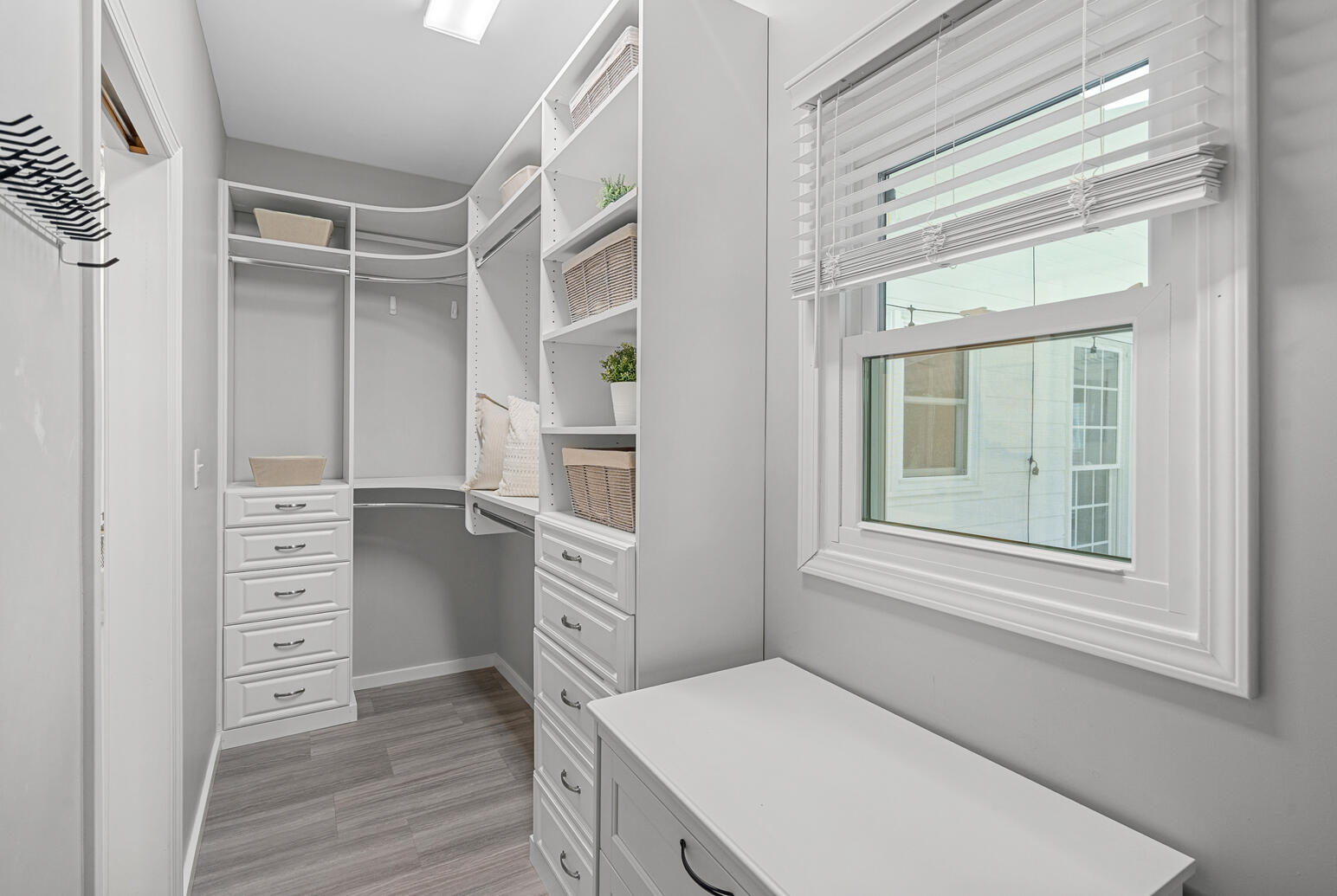 Huntersville NC home for sale featuring primary suite closet with ample storage and modern design.