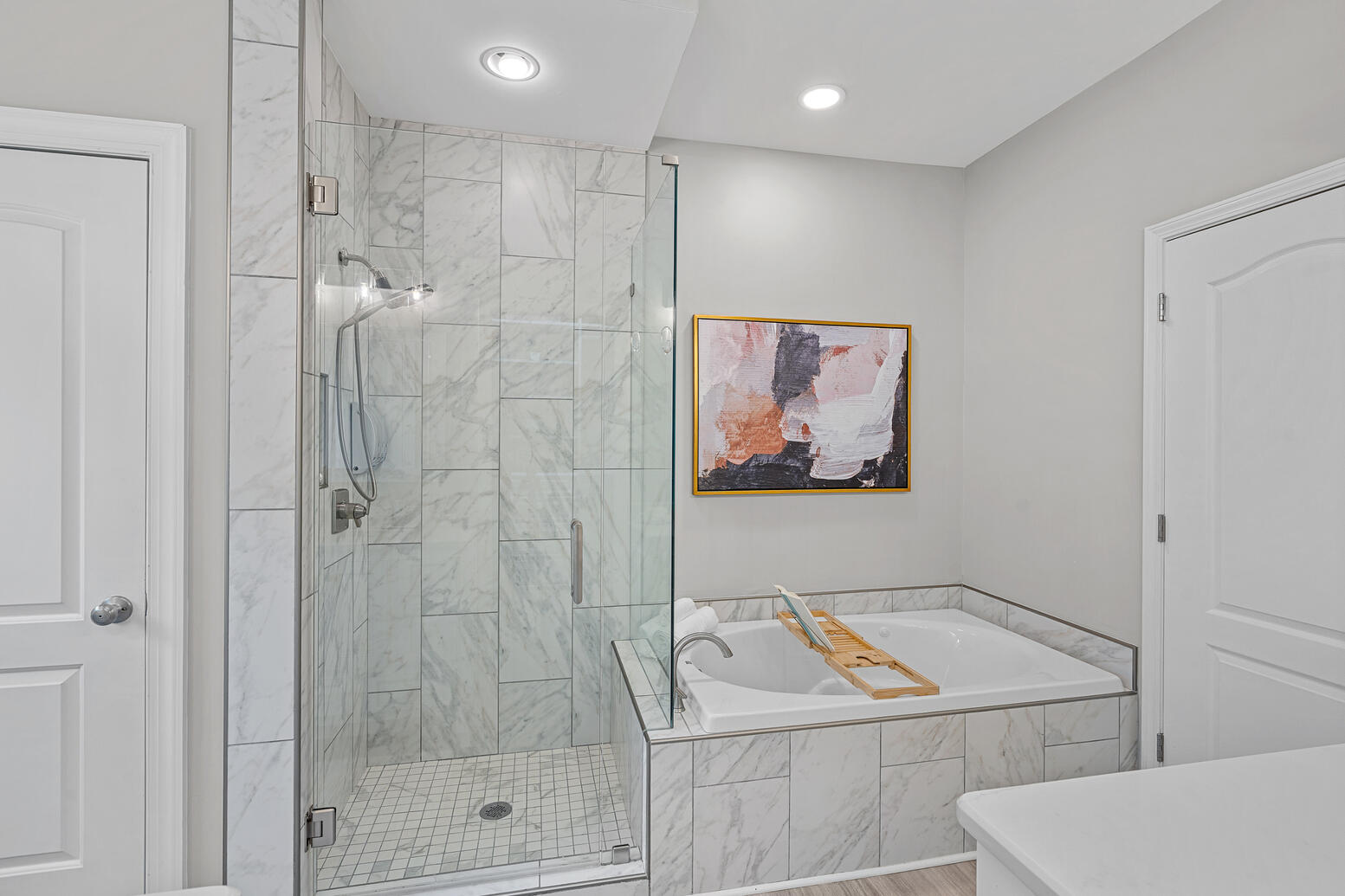 Owner’s suite with en‑suite bathroom and walk‑in closet at 8948 Devonshire Drive Huntersville NC