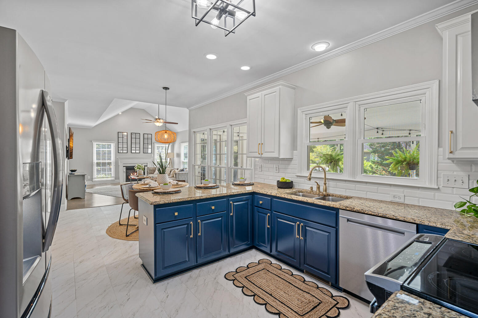 Huntersville Birkdale home kitchen with upgraded cabinetry, island seating, and open floor plan.