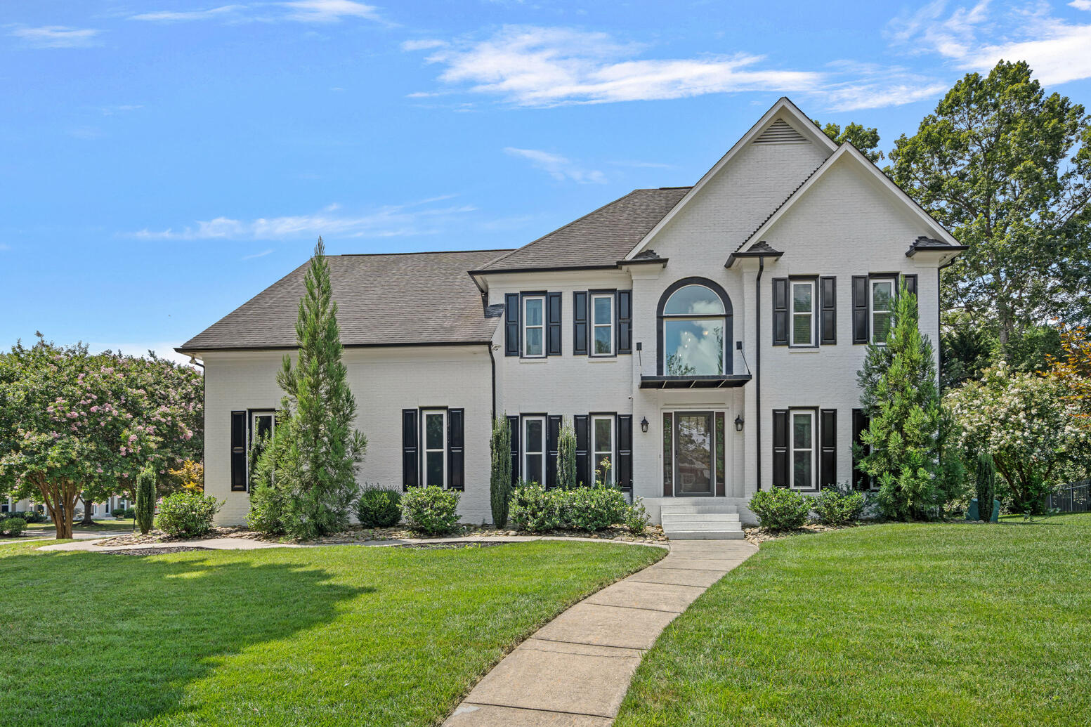 Beautifully maintained four‑bedroom home in Birkdale Huntersville with spacious front yard and modern upgrades