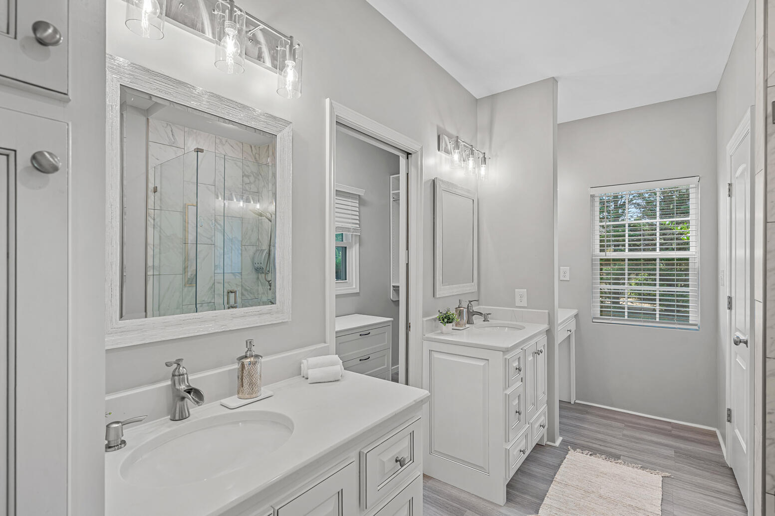 Owner’s suite with en‑suite bathroom and walk‑in closet at 8948 Devonshire Drive Huntersville NC