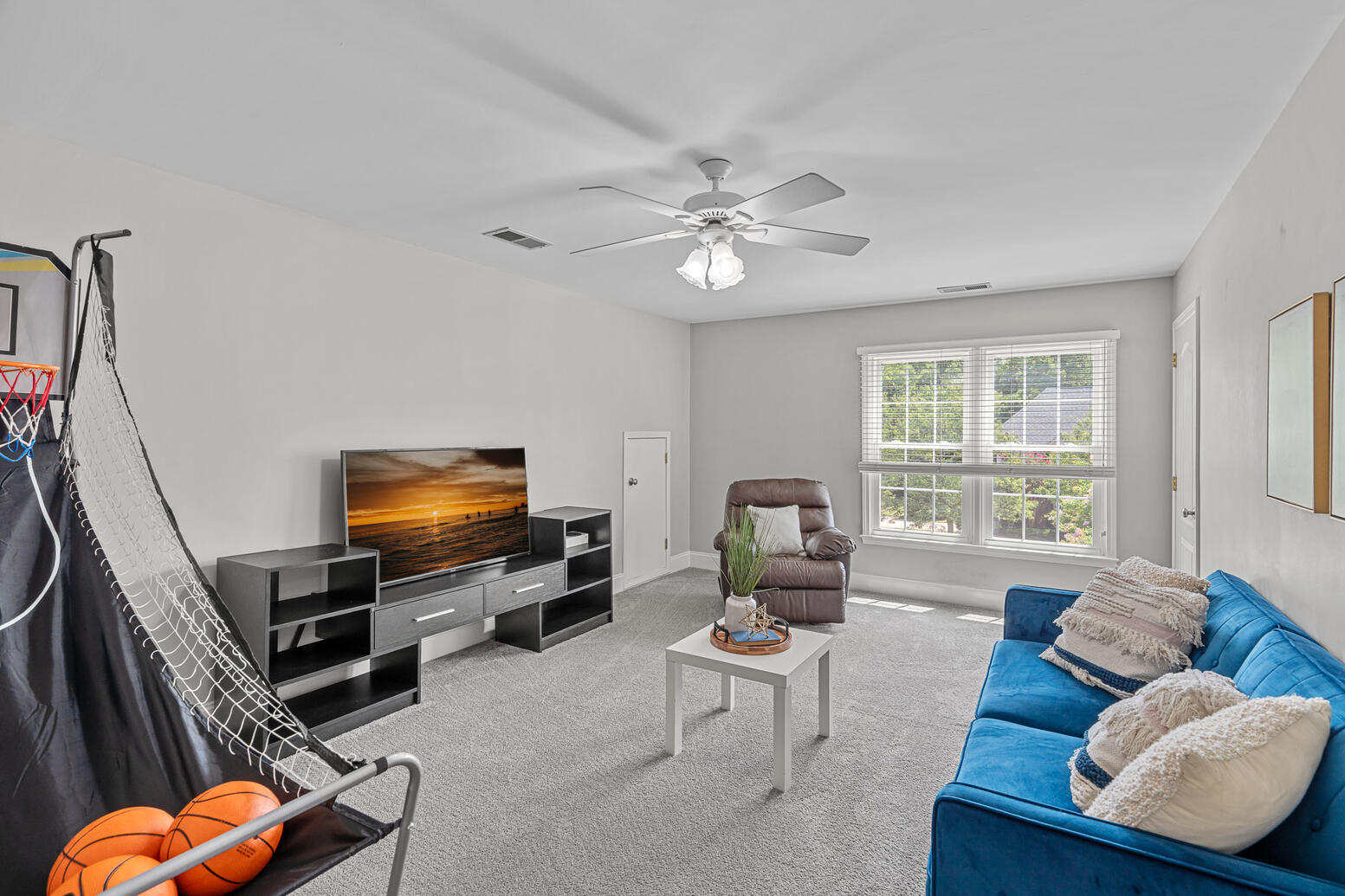 Multi‑purpose room in Huntersville NC home for sale ideal for media or recreation.