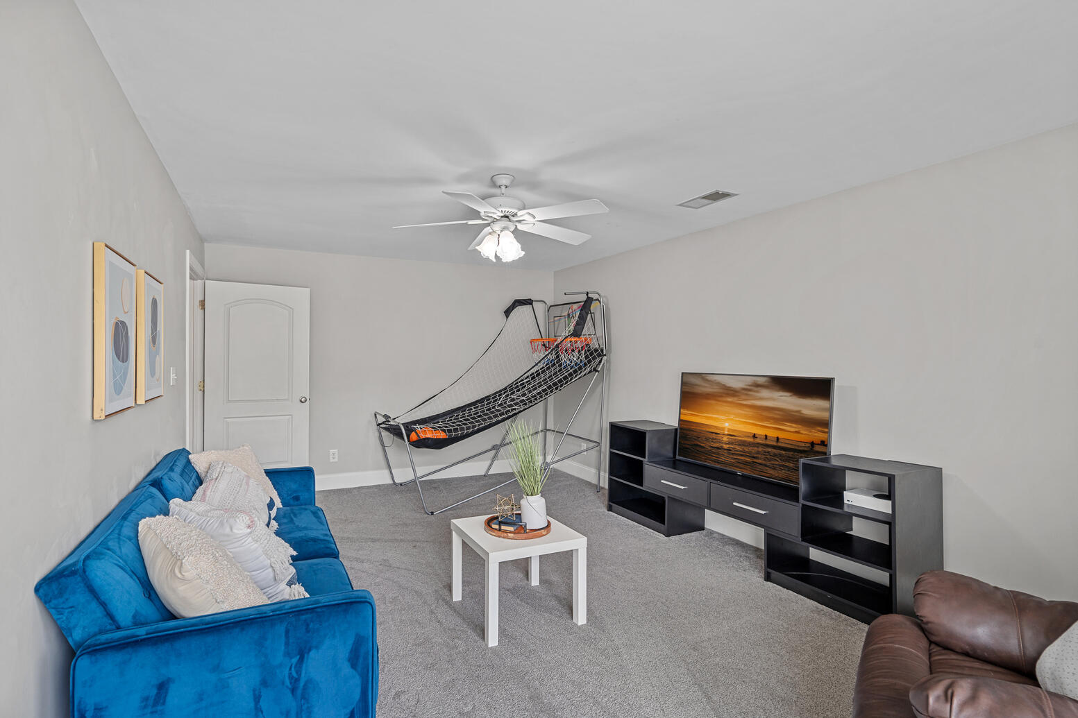 Spacious upstairs bonus room in Birkdale Huntersville home for flexible living space.