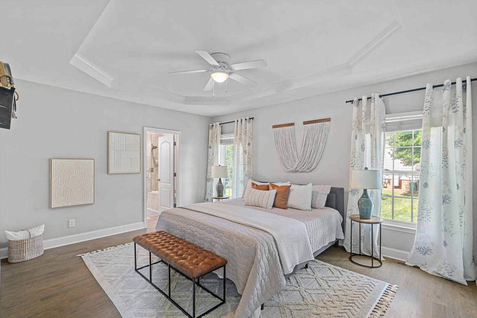 Spacious primary bedroom in Birkdale Huntersville home with natural light and modern design.